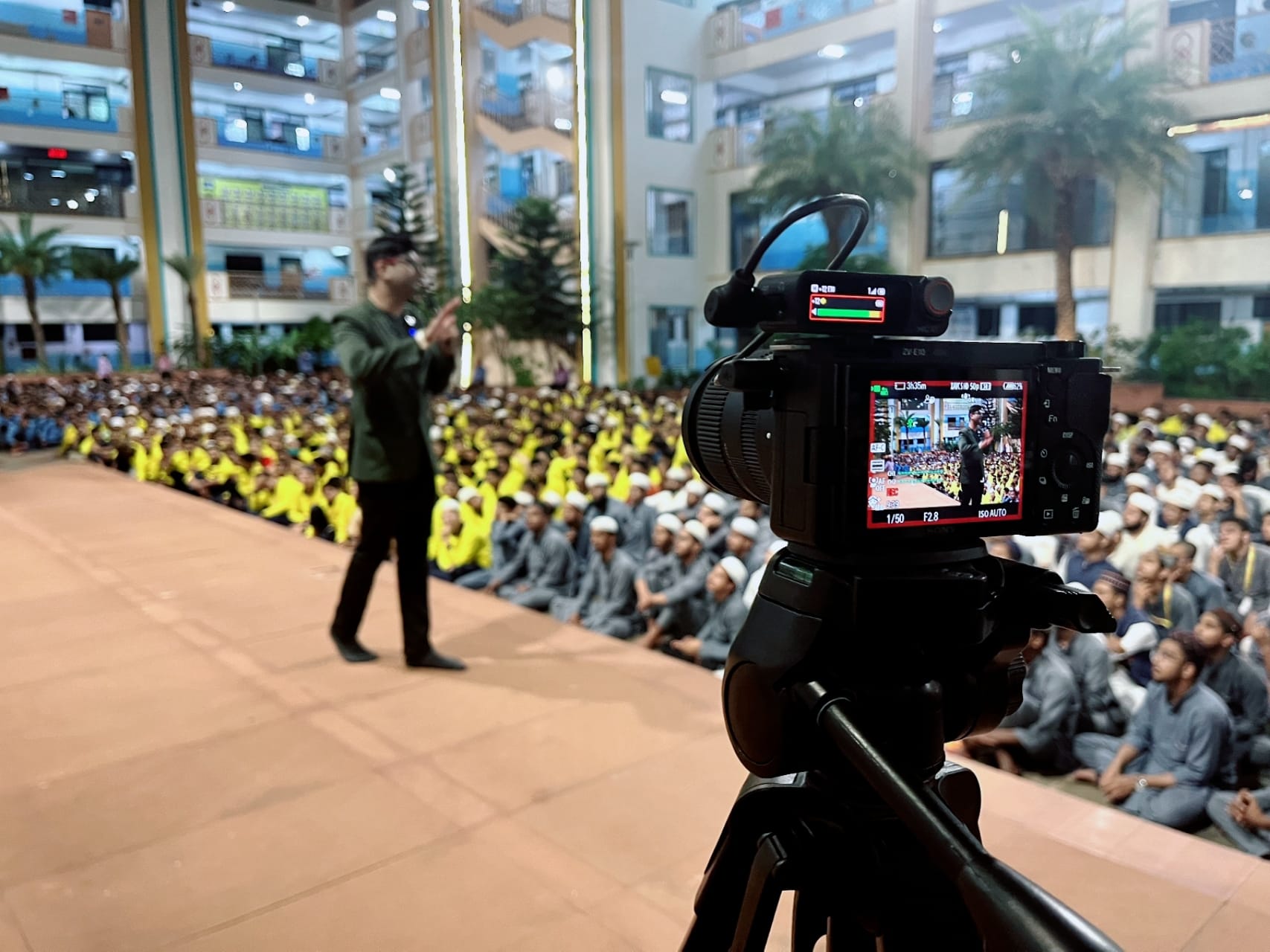 Dr. Arshad Sayyed speaking to a large audience